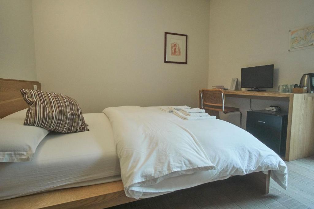 Postel nebo postele na pokoji v ubytování Agriturismo CasaMela