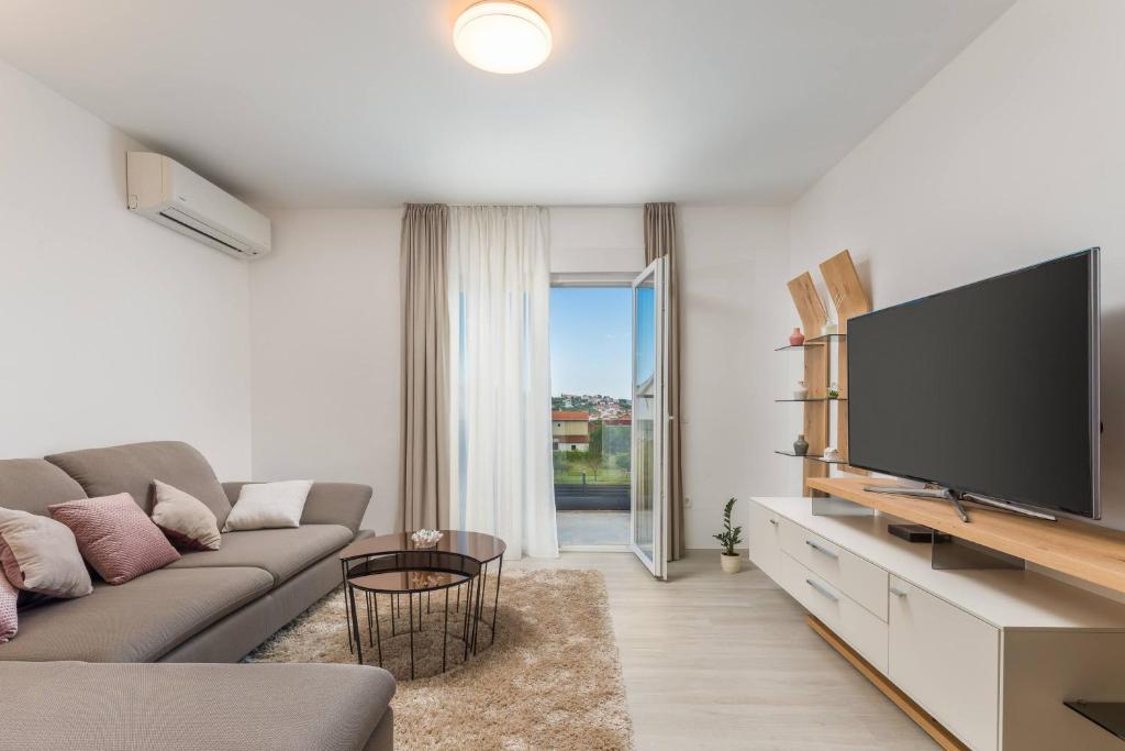 Televízia a/alebo spoločenská miestnosť v ubytovaní Apartment Apollo 3