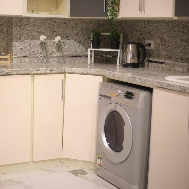 Kuchyň nebo kuchyňský kout v ubytování Apartment in Mohandesin (Families Only)