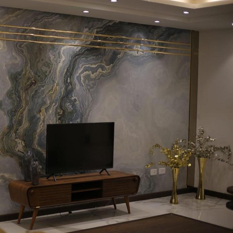 TV a/nebo společenská místnost v ubytování Apartment in Mohandesin (Families Only)
