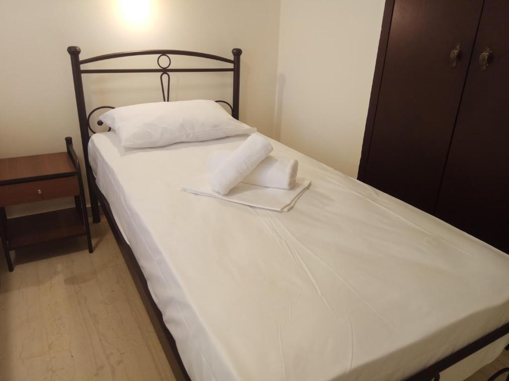 Postel nebo postele na pokoji v ubytování Omiros