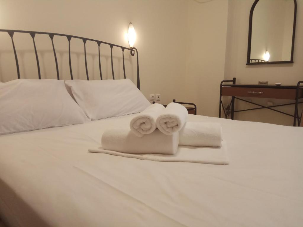Postel nebo postele na pokoji v ubytování Omiros