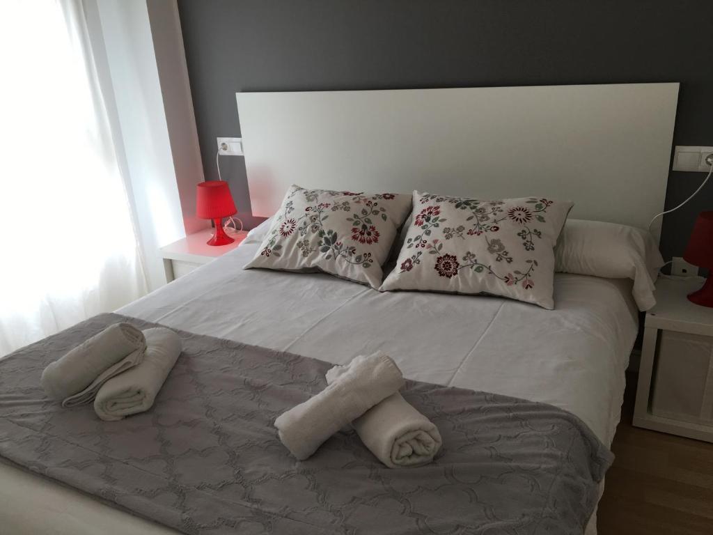 Posteľ alebo postele v izbe v ubytovaní Apartaments Muntaner I