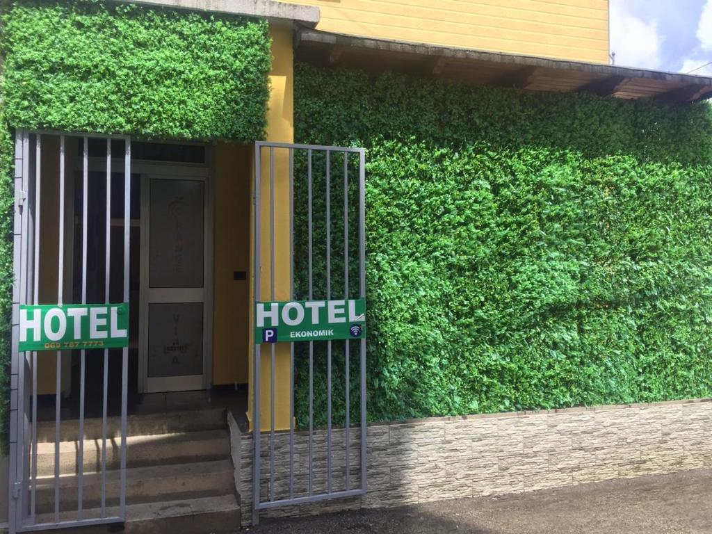 a green street sign sitting on the side of a building at Orange Villa Hotel in Tirana