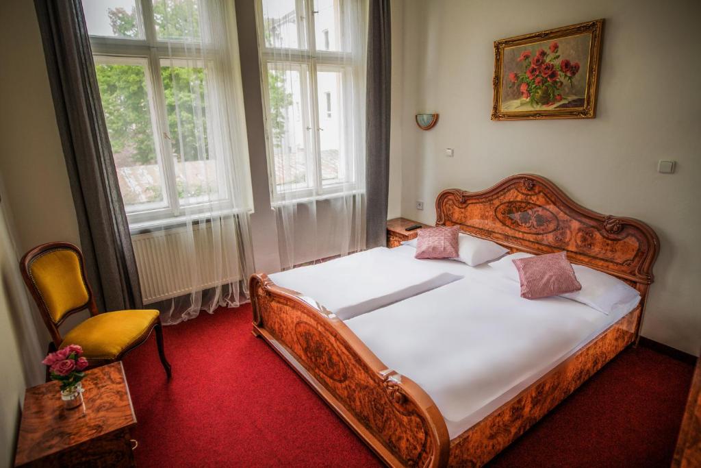 Postel nebo postele na pokoji v ubytování Hotel Dejmalik