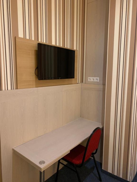 TV a/nebo společenská místnost v ubytování Hotel New Fair Munich Messe