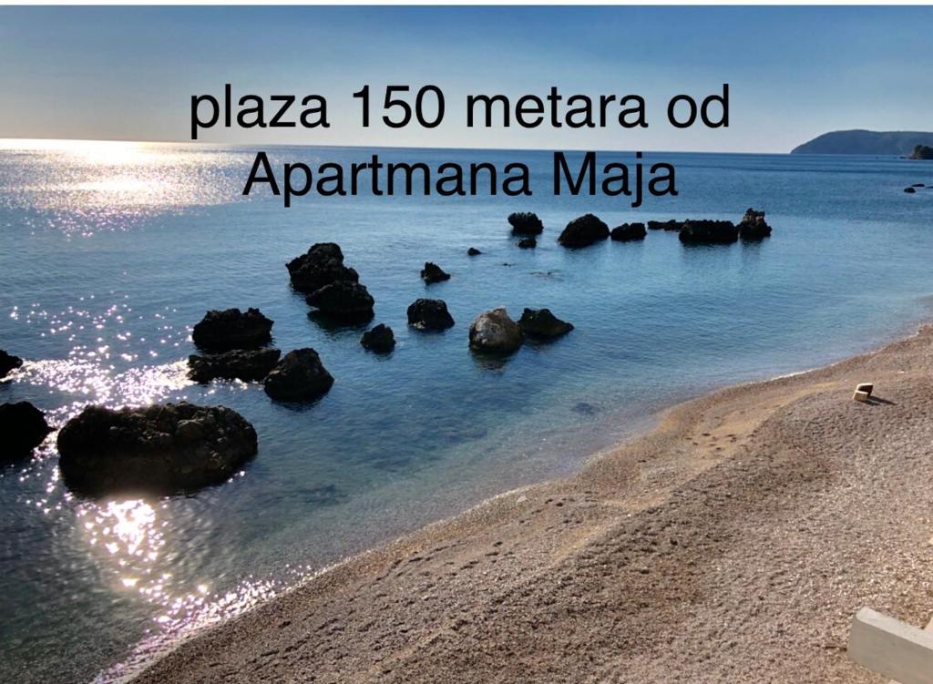 a view of a beach with rocks in the water at Apartmani Maja in Bar