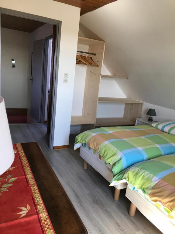 Postel nebo postele na pokoji v ubytování Gite Du Rittersberg