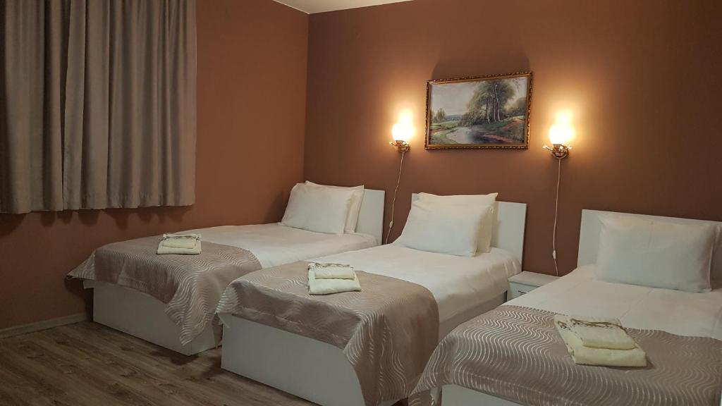 Postel nebo postele na pokoji v ubytování MARIANA - guest rooms