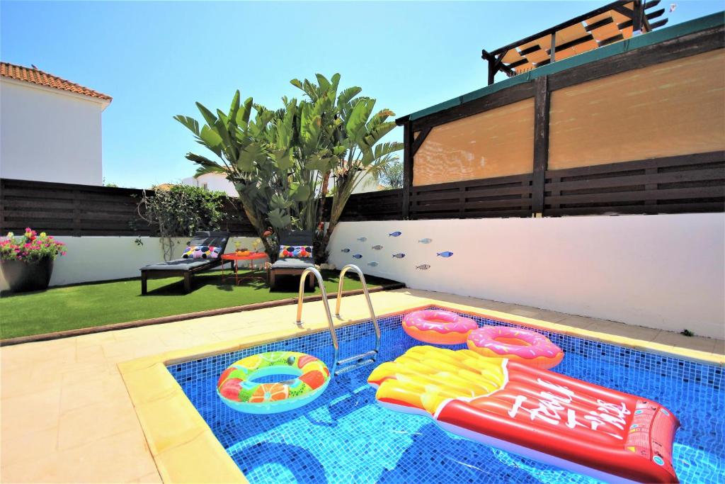 a pool with a water park with a inflatable at Palm Paradise Villa in Ayia Napa