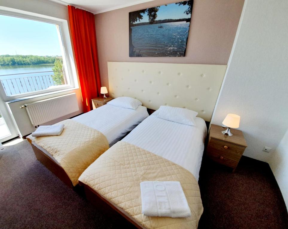 Posteľ alebo postele v izbe v ubytovaní Hotel Mazuria Country & SPA