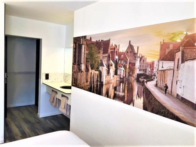 Postel nebo postele na pokoji v ubytování Canalview Hotel Ter Reien
