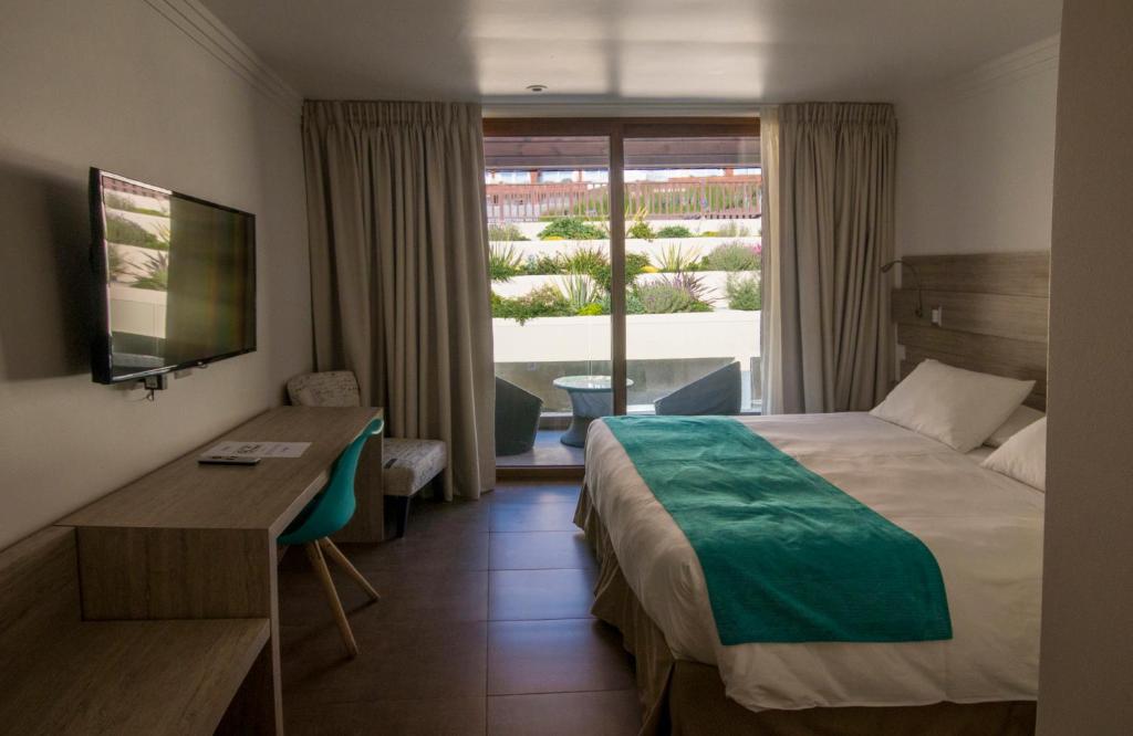 Postel nebo postele na pokoji v ubytování Hotel Mae