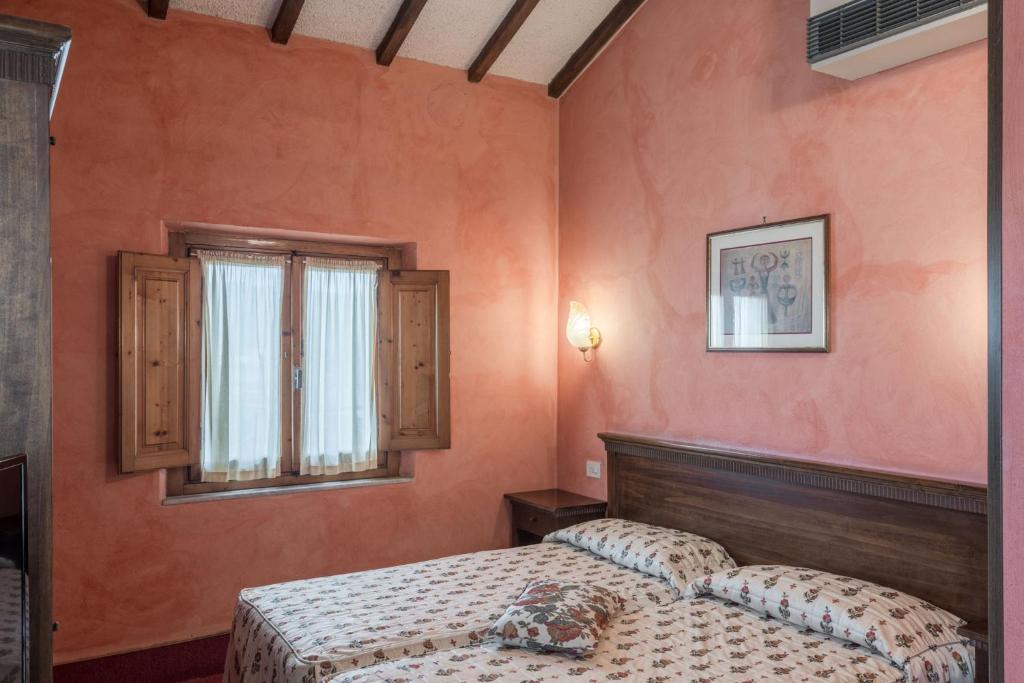 Postel nebo postele na pokoji v ubytování Hotel Minerva Palace