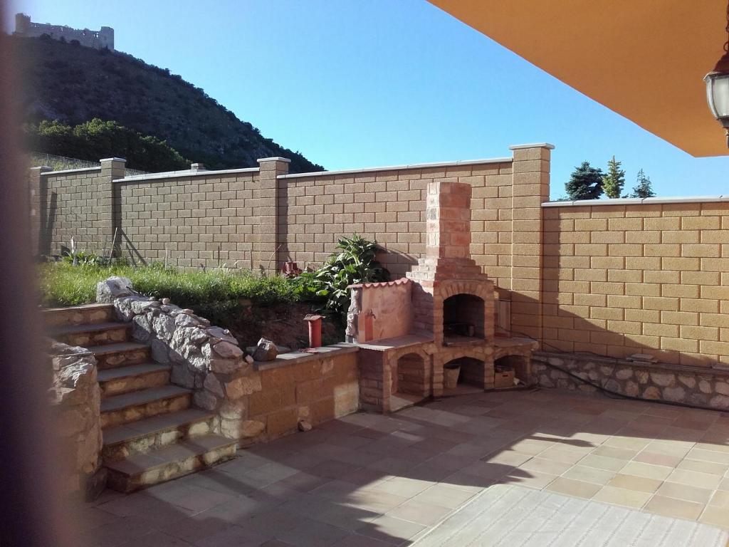 a brick wall with a brick oven in a courtyard at Pavlov Děvicky in Pavlov