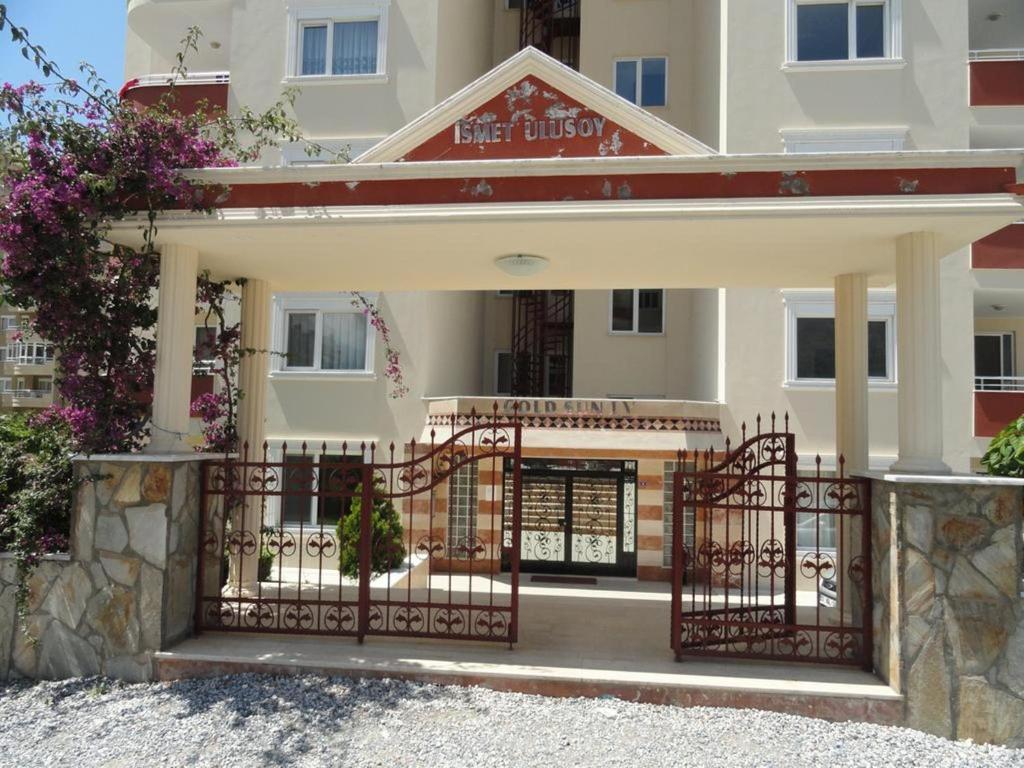 a house with a gate in front of it at Gold Sun 4 in Mahmutlar