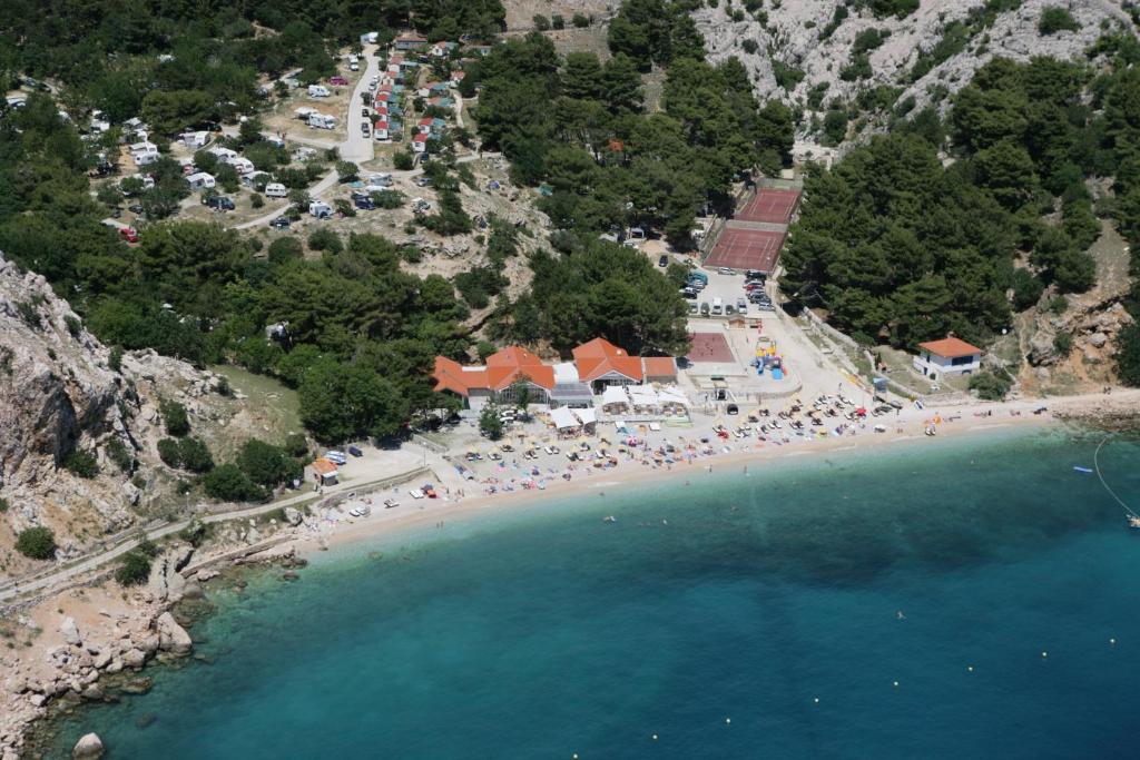 an aerial view of a beach with a group of people at FKK Bunculuka Camping Resort by Valamar in Baška