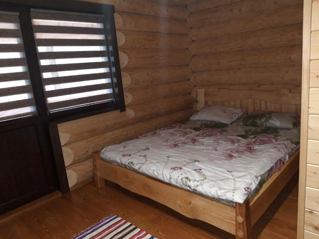 Postel nebo postele na pokoji v ubytování Маєток горгани