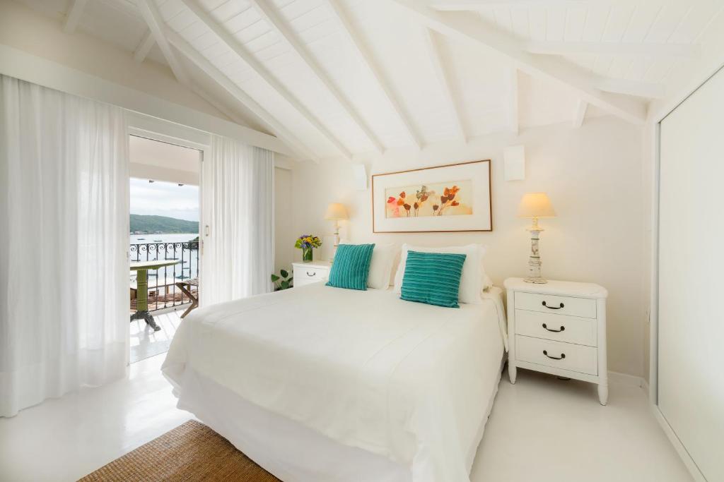 Postel nebo postele na pokoji v ubytování Abracadabra Boutique Hotel