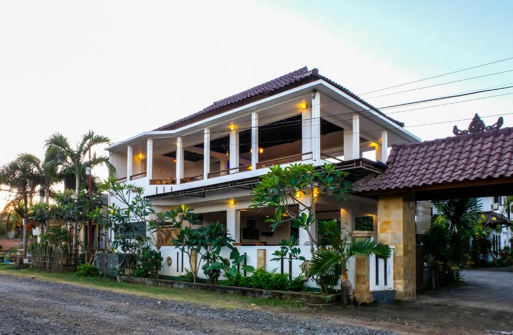 a house on the side of the road at Friends Beach Hotel in Kuta Lombok