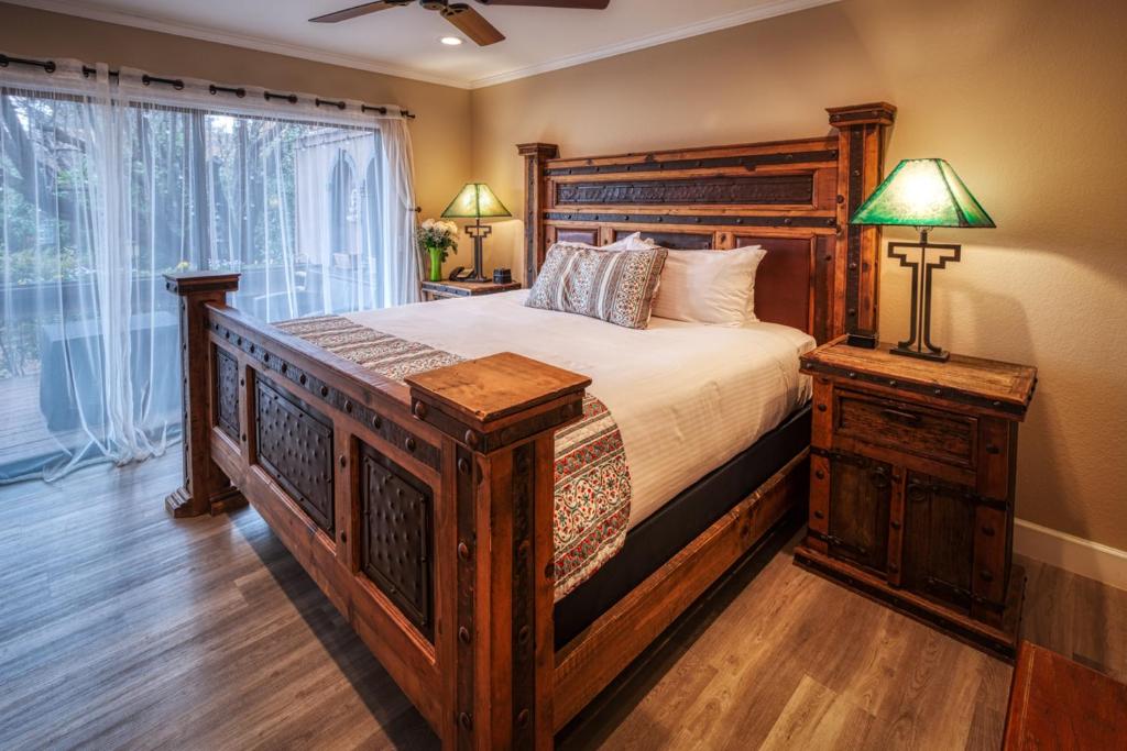 a bedroom with a large bed and a large window at Lantern Light Inn - Romantic Getaway in Sedona