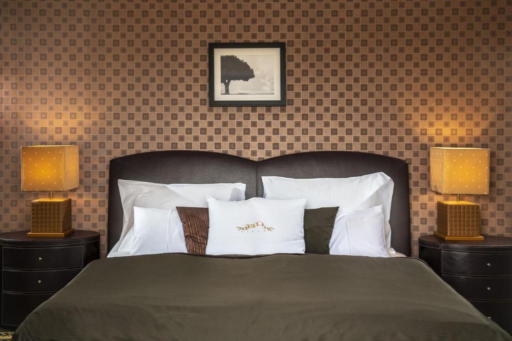 Postel nebo postele na pokoji v ubytování Erla Villa Boutique Hotel