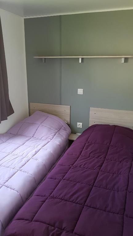 Postel nebo postele na pokoji v ubytování Camping Saint Laurent