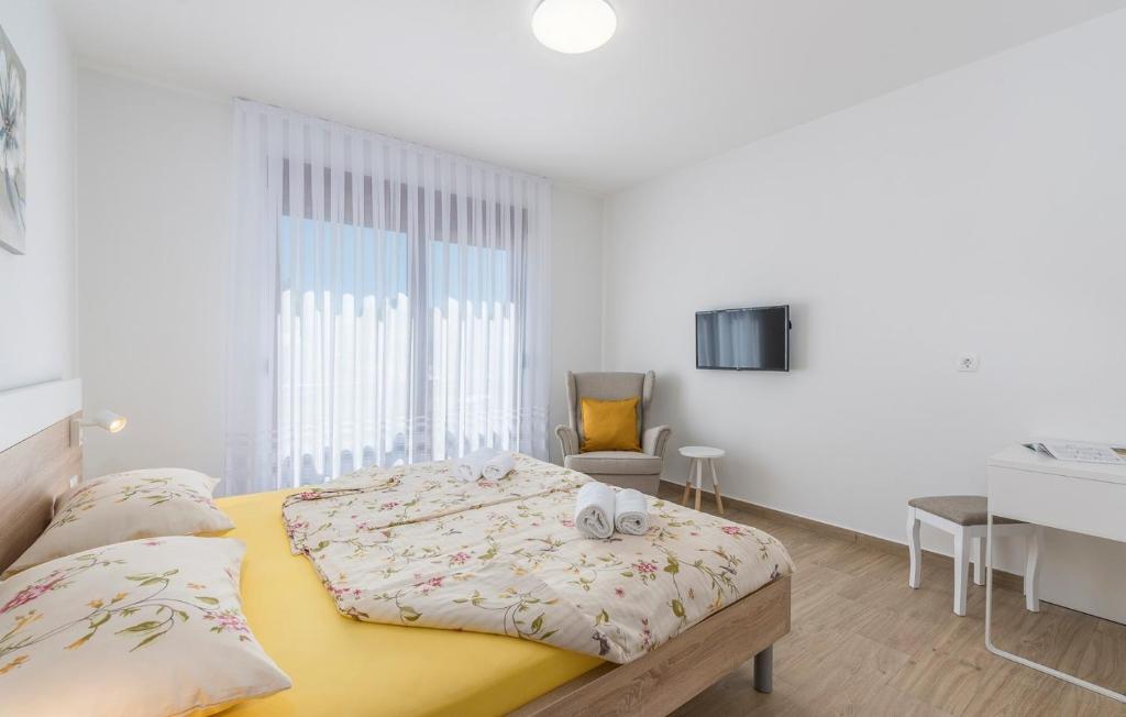 Posteľ alebo postele v izbe v ubytovaní Apartments Hana in Funtana