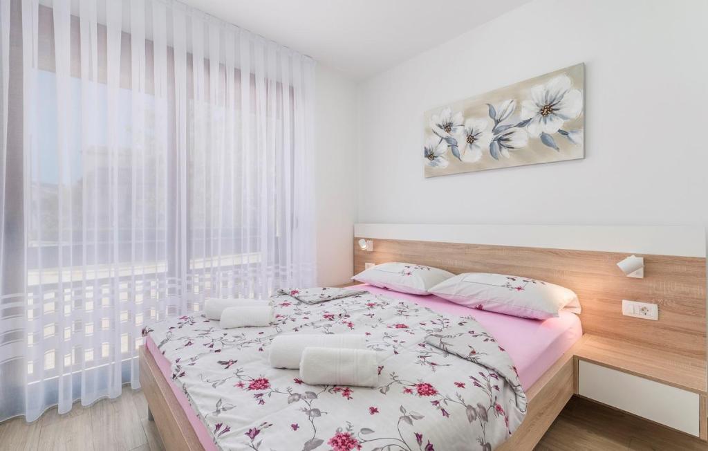 Posteľ alebo postele v izbe v ubytovaní Apartments Hana in Funtana