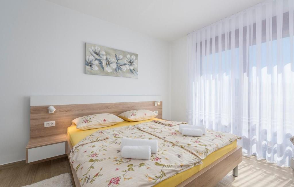 Posteľ alebo postele v izbe v ubytovaní Apartments Hana in Funtana