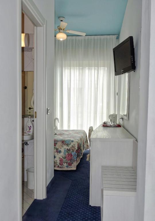 Postel nebo postele na pokoji v ubytování Hotel Tridentum