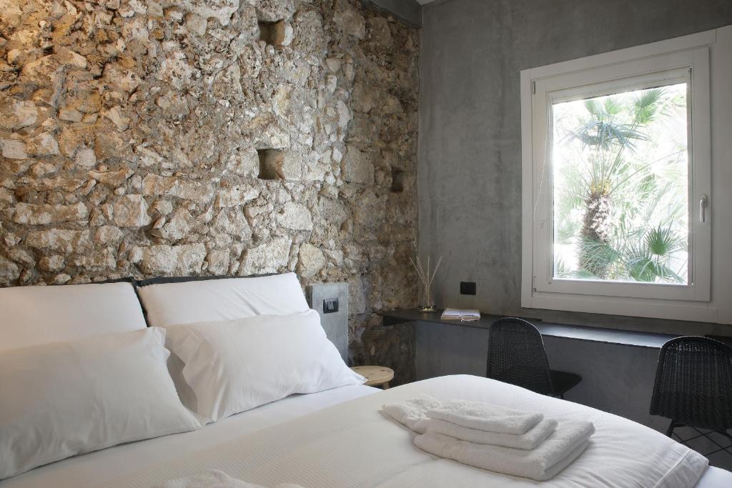Postel nebo postele na pokoji v ubytování ISONZO SUITES