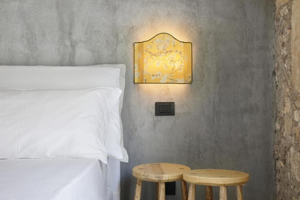 Postel nebo postele na pokoji v ubytování ISONZO SUITES