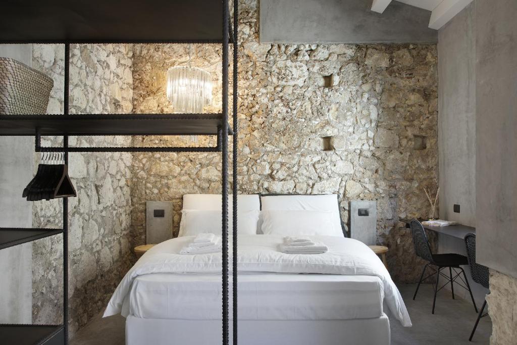 Postel nebo postele na pokoji v ubytování ISONZO SUITES