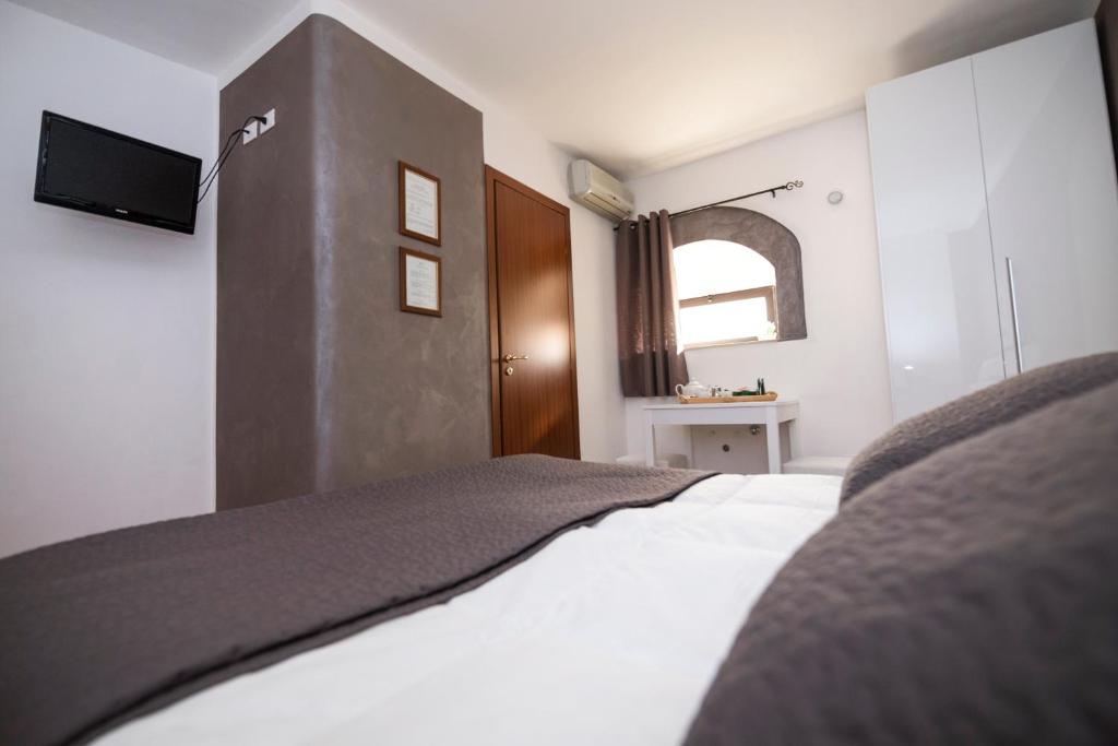 Postel nebo postele na pokoji v ubytování Bed and Breakfast Alberini