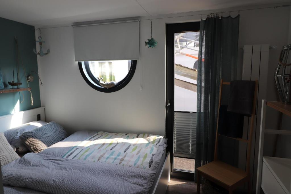 Postel nebo postele na pokoji v ubytování Havenkoje