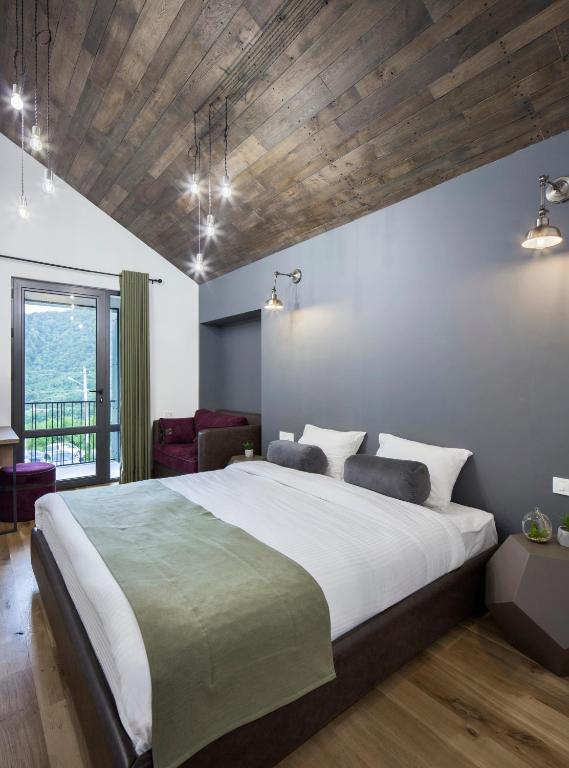 Postel nebo postele na pokoji v ubytování Hover Boutique Hotel