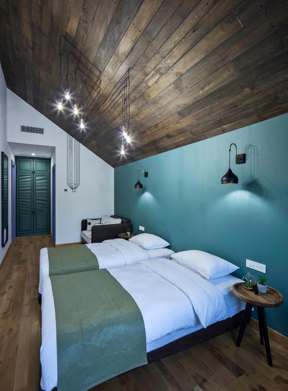 Postel nebo postele na pokoji v ubytování Hover Boutique Hotel