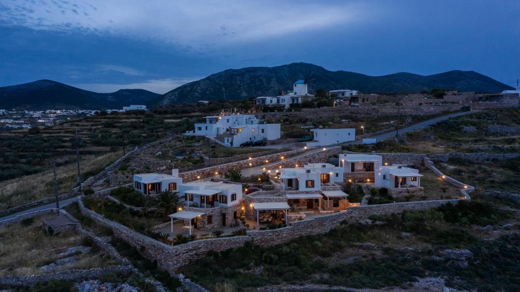 an aerial view of a house on a hill at night at Loukia Apartments in Artemonas
