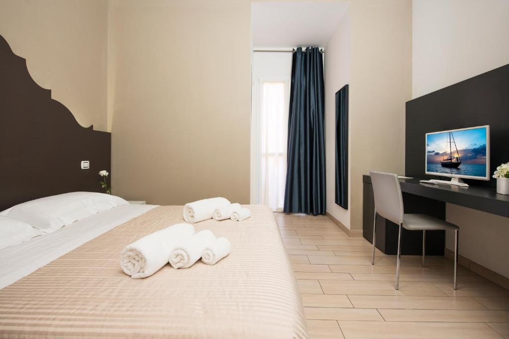 Postel nebo postele na pokoji v ubytování Hotel Fiamma & Spa