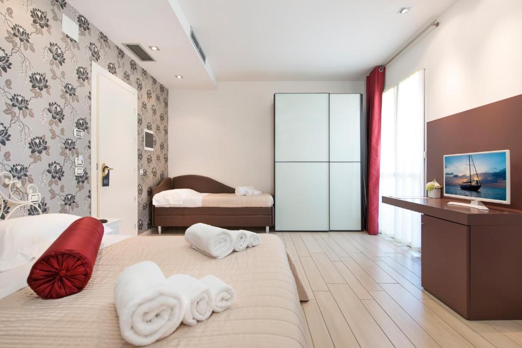Postel nebo postele na pokoji v ubytování Hotel Fiamma & Spa