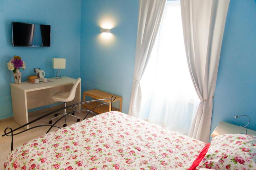 Łóżko lub łóżka w pokoju w obiekcie Affittacamere Rosy
