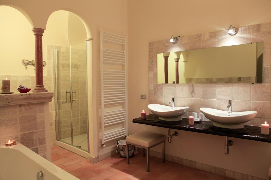 a bathroom with two sinks and a shower at Casa Vannucci in Perugia