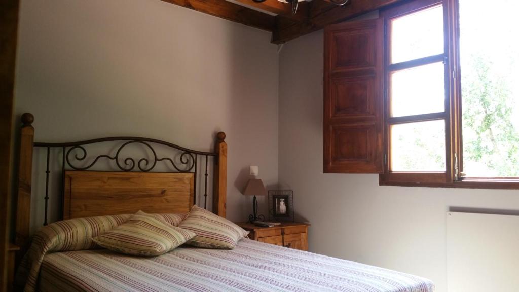 Postel nebo postele na pokoji v ubytování LAS VILLAS DEL PONTON