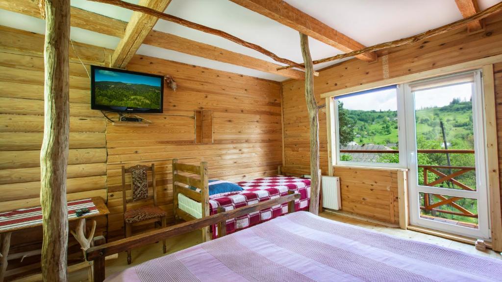 Postel nebo postele na pokoji v ubytování Eco Centr Zrub