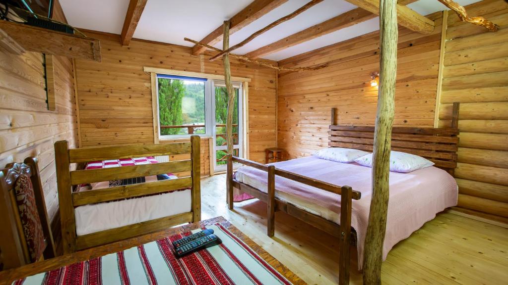 Postel nebo postele na pokoji v ubytování Eco Centr Zrub