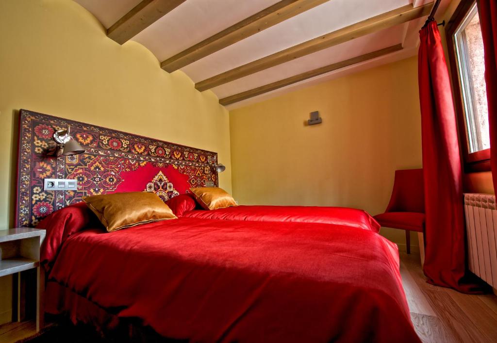 Postel nebo postele na pokoji v ubytování Hotel Albanuracín