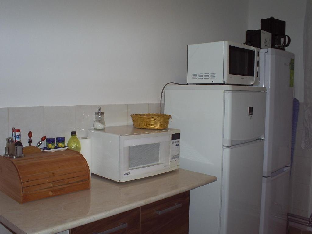 Kuchyň nebo kuchyňský kout v ubytování Harmatcsepp Apartmanház