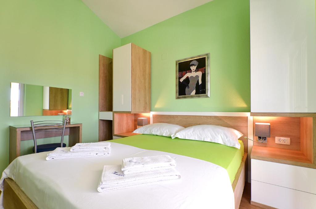 Postel nebo postele na pokoji v ubytování Apartments Tomislav