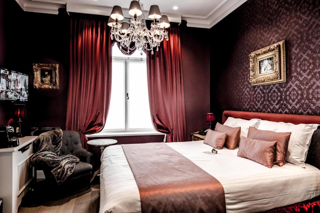 Postel nebo postele na pokoji v ubytování Boutique Hotel De Castillion